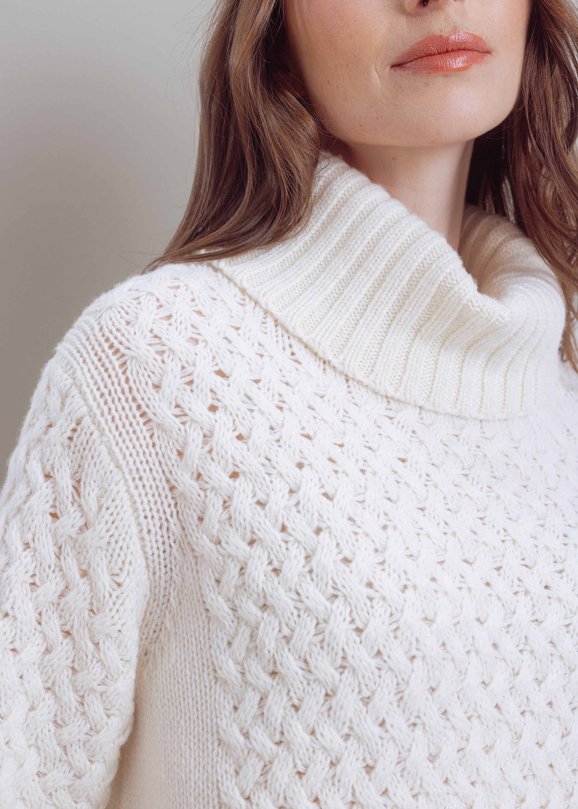Turtleneck sweater with cable pattern made of pure wool