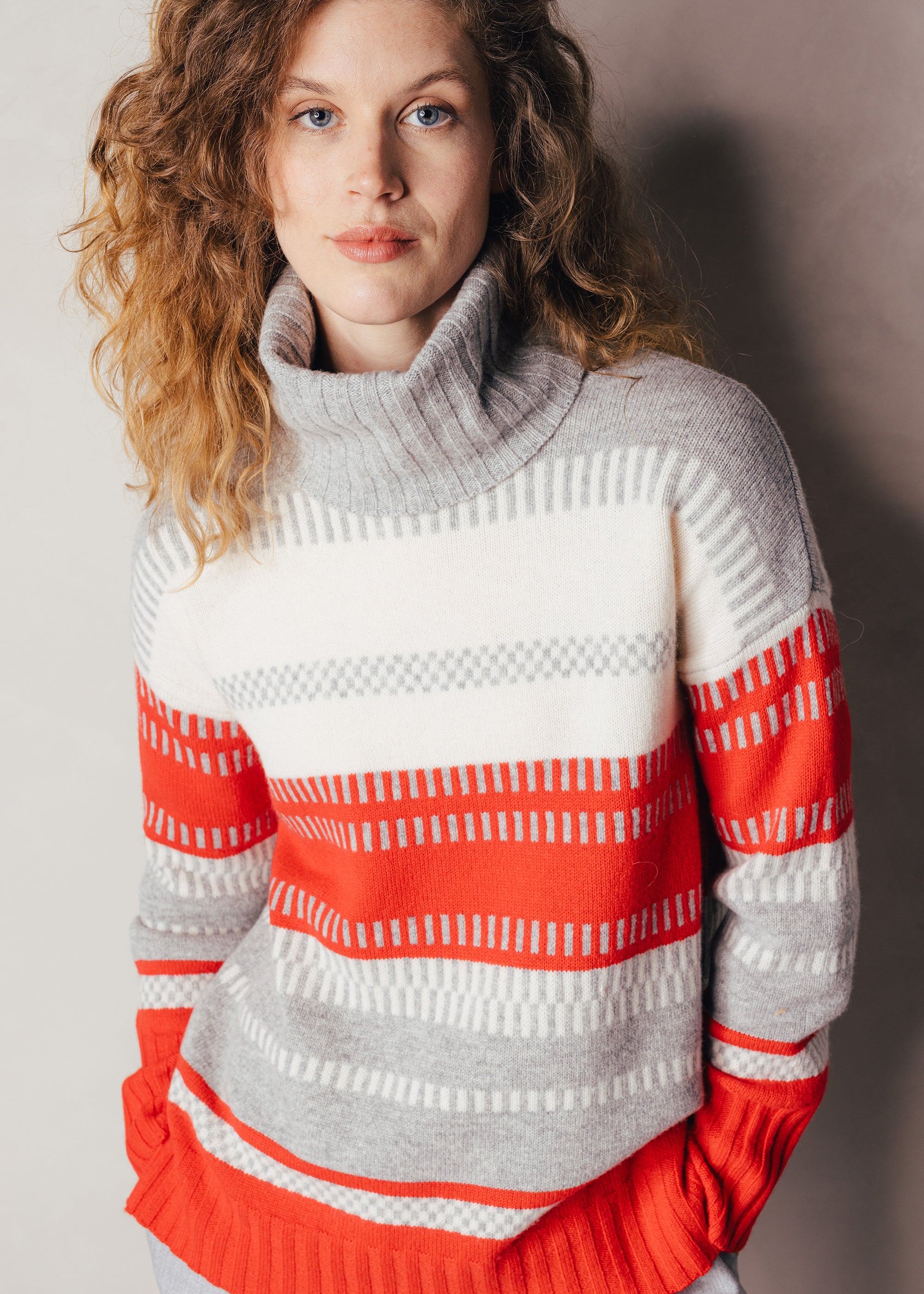 Long wool sweater with turtleneck and graphic stripes