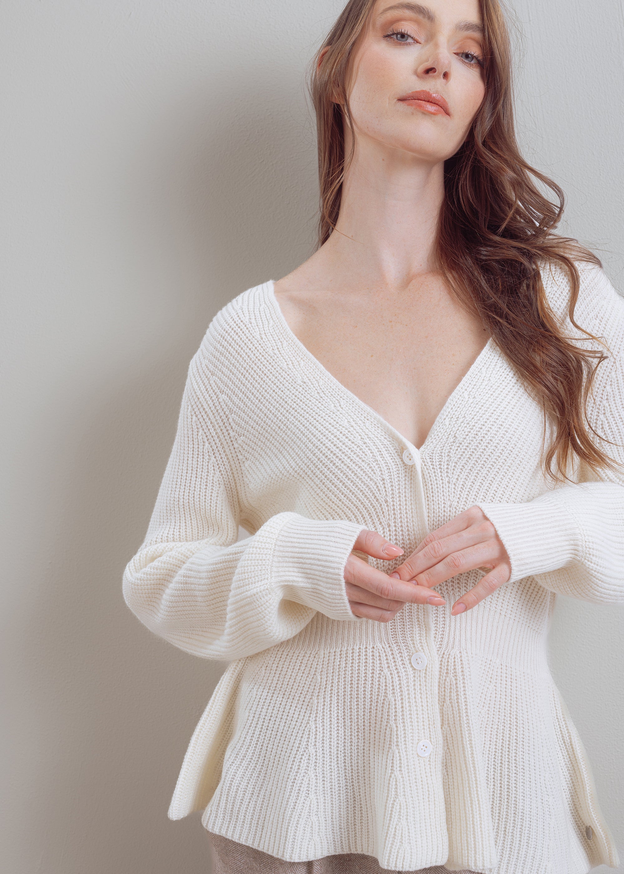 Wool cardigan with peplum