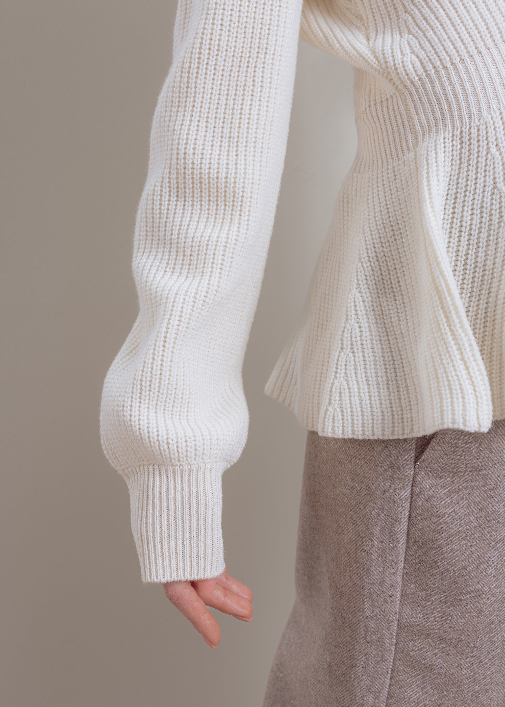 Wool cardigan with peplum