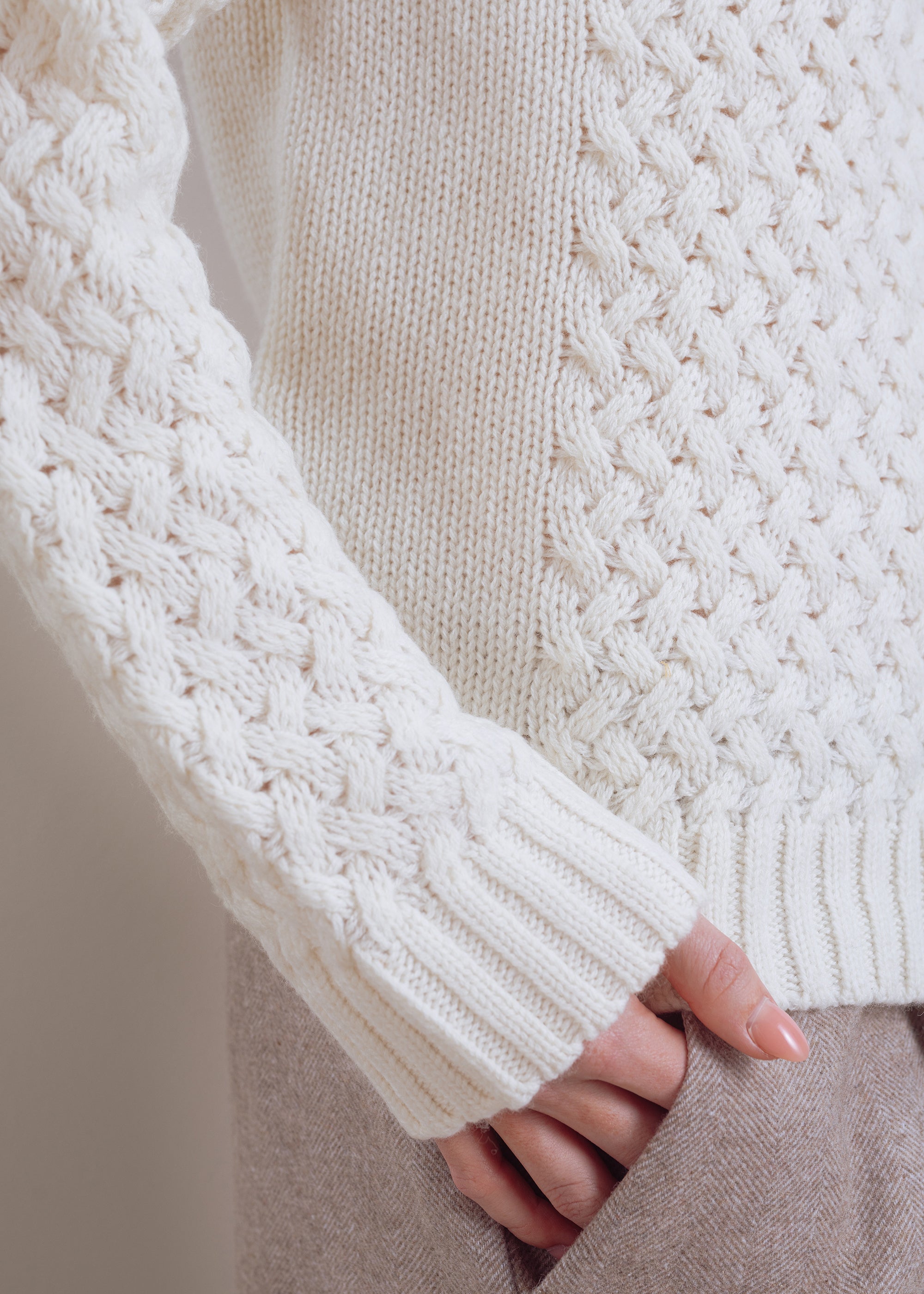 Turtleneck sweater with cable pattern made of pure wool