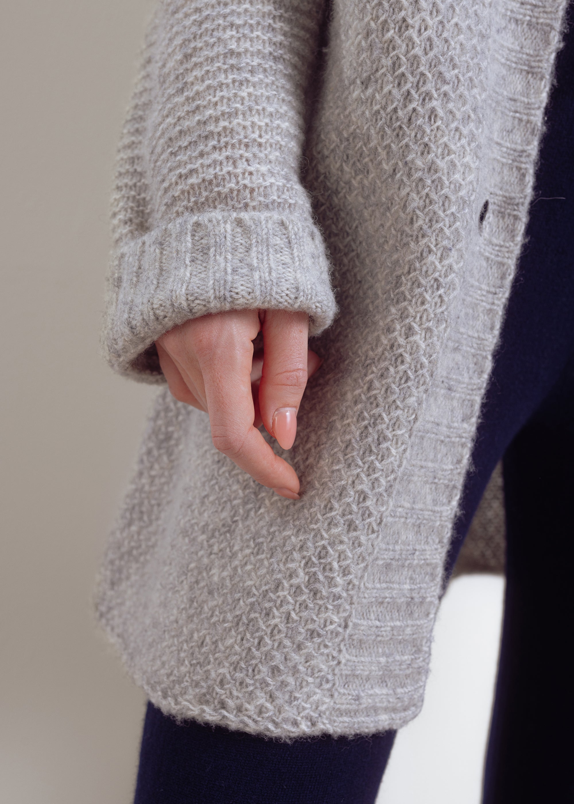 Knitted coat in structured knit made of wool-cotton mix